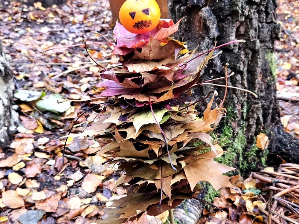 A Halloween forest man made from fallen leaves